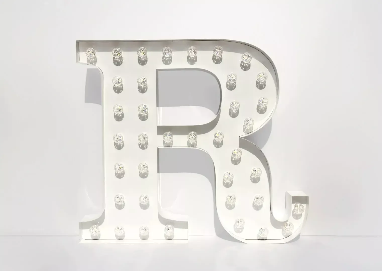 Letter R - luminous letter with white light bulbs