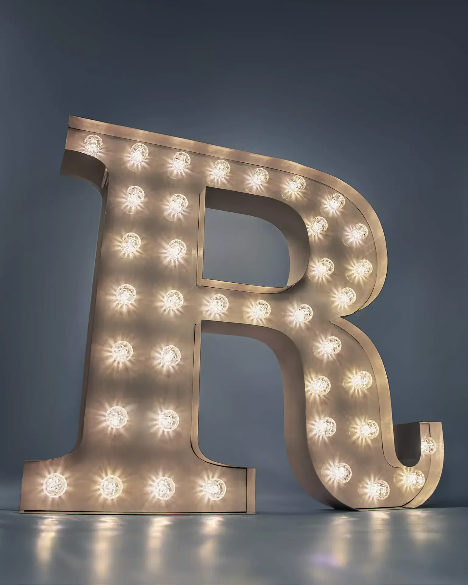 Letter R - luminous letter with white light bulbs