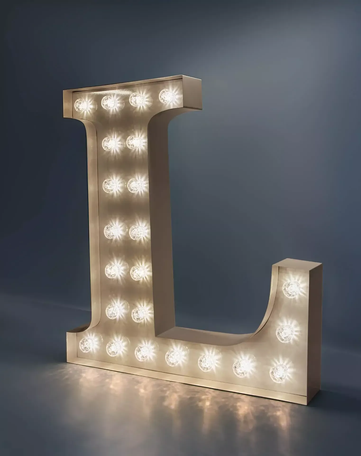 Letter L - luminous letter with white light bulbs