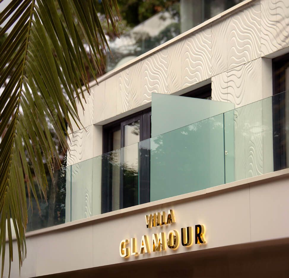 Villa Glamour - letters made of gold polished stainless steel, back-lit on the wall